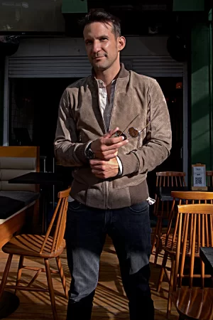 grand prix bomber jacket in perforated suede taupee